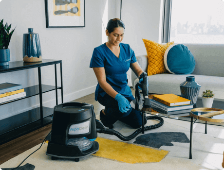maid cleaning living room